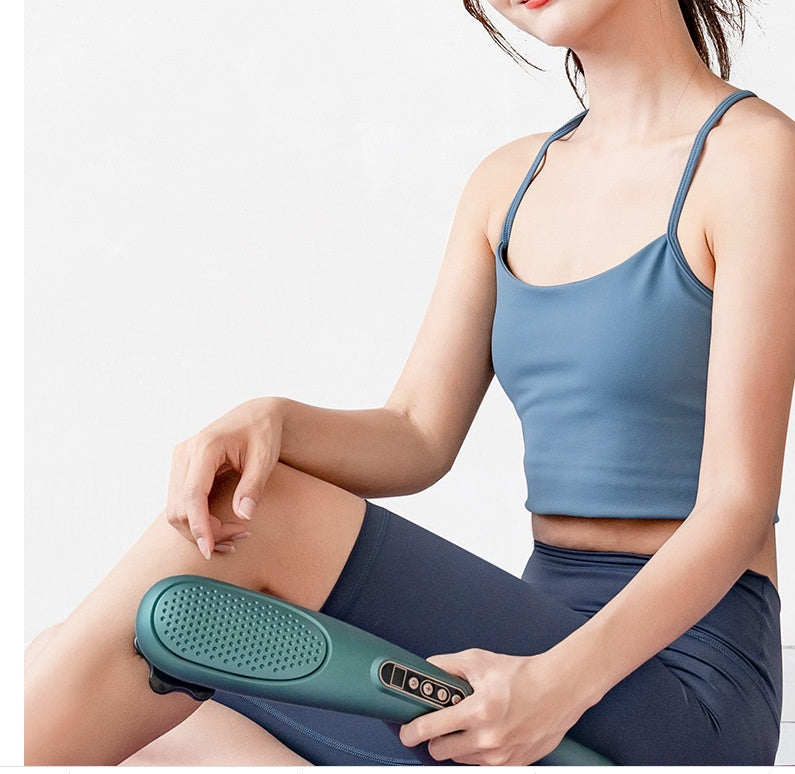 User applying New Rechargeable Massager Massage on thigh; portable electric massager for deep tissue and muscle therapy.